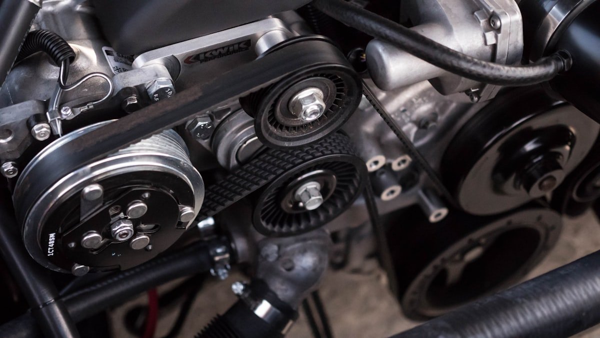 Close-up of automotive under-hood mechanical components related to ride height and suspension geometry